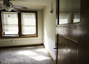 Thumbnail 3 of 100 - A room with a ceiling fan and a window with blinds.