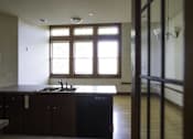Thumbnail 42 of 100 - A kitchen with a sink and a window.