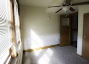 Thumbnail 55 of 100 - A room with a ceiling fan and a door.