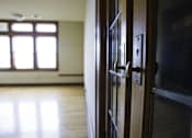 Thumbnail 56 of 100 - A brown door with a handle and a lock.