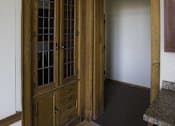 Thumbnail 65 of 100 - A brown wooden door with glass panels and a handle.