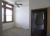 Thumbnail 84 of 100 - A room with a ceiling fan and a window.