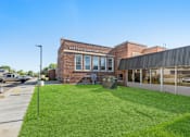 Thumbnail 26 of 29 - A brick building with a sign that says Barton Elementary School.