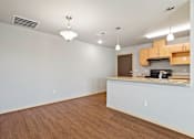 Thumbnail 21 of 27 - A kitchen area with a counter and cabinets.