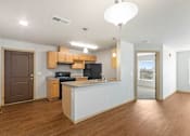 Thumbnail 12 of 27 - A kitchen with a white counter and wooden cabinets.
