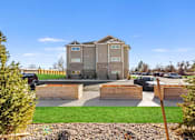 Thumbnail 16 of 27 - A modern two-story house with a large front yard.