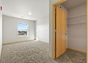 Thumbnail 8 of 27 - A room with a door and a window.