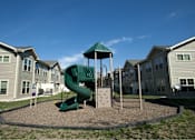 Thumbnail 2 of 15 - A playground with a green slide and a green canopy.