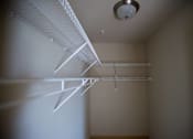 Thumbnail 25 of 25 - A white shelf is mounted on a wall.