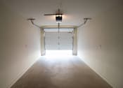 Thumbnail 24 of 25 - A long hallway with a door at the end.