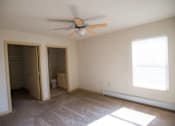 Thumbnail 20 of 25 - A room with a ceiling fan and a window with blinds.