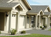 Thumbnail 13 of 21 - A house with a grey roof and white columns.