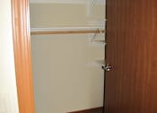 Thumbnail 11 of 18 - A brown door with a white handle and a shelf.