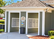 Thumbnail 9 of 14 - A small building with a sign that says mail kiosk.