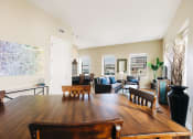 Thumbnail 2 of 39 - a dining room with a wooden table and a living room at Metro67, Memphis, TN, 38103