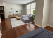 Thumbnail 7 of 39 - a bedroom and living room with a bed and a couch at Metro67, Memphis, 38103