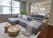 Thumbnail 9 of 39 - a living room with a couch and a bed at Metro67, Memphis, Tennessee, 38103