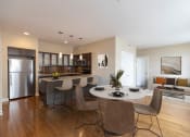 Thumbnail 11 of 39 - a kitchen and dining room with a table and chairs at Metro67, Memphis, TN