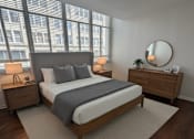 Thumbnail 7 of 12 - A bedroom with a large bed, a dresser, and a mirror.