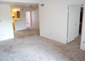 Thumbnail 1 of 26 - an empty living room with white walls and carpet