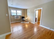 Thumbnail 14 of 43 - Living room with wooden floor at Convent Gardens Apartments, St. Louis, 63108