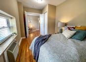Thumbnail 16 of 43 - Bedroom with cozy bed at Convent Gardens Apartments, St. Louis
