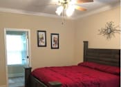 Thumbnail 7 of 7 - a bedroom with a bed and a ceiling fan