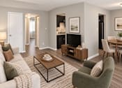 Thumbnail 10 of 17 - A living room with a grey couch, a coffee table, and a chair.