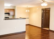 Thumbnail 7 of 14 - A kitchen with a counter and a door.