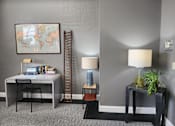 Thumbnail 4 of 43 - A room with a grey wall and a world map on the wall.