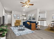 Thumbnail 1 of 28 - a living room with a blue couch and a ceiling fan at Osage Creek, Arkansas, 72756