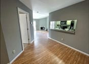 Thumbnail 5 of 26 - a view of the living room and kitchen from the dining room