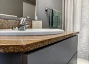 Thumbnail 10 of 26 - a bathroom with a sink and a mirror