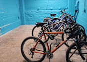 Thumbnail 39 of 43 - A bicycle is parked in a garage.