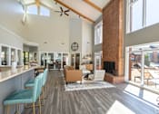 Thumbnail 24 of 26 - A modern open plan living area with a fireplace and a dining area.