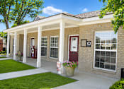 Thumbnail 2 of 5 - A house with a red door and a sign that says "For Sale".