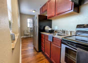 Thumbnail 24 of 43 - Black appliances at Convent Gardens Apartments, Missouri, 63108