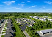 Thumbnail 43 of 43 - A bird's eye view of a residential area with houses and a large building.
