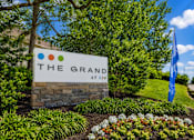Thumbnail 33 of 43 - A sign that says "The Grand" in front of a building.