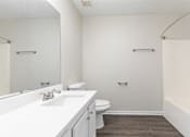 Thumbnail 18 of 35 - A white bathroom with a toilet and sink.
