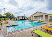 Thumbnail 1 of 35 - A pool with a yellow and green sun lounger.