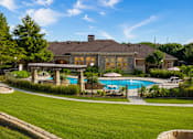 Thumbnail 30 of 61 - A large house with a pool in the backyard.