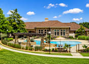 Thumbnail 61 of 61 - A house with a pool in the backyard.