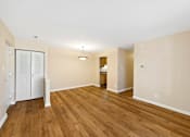 Thumbnail 21 of 21 - A room with wooden floors and white walls.