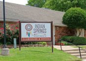 Thumbnail 5 of 6 - a building with a sign that says indian springs apartments