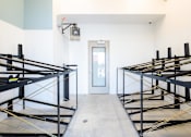 Thumbnail 22 of 22 - A room with bunk beds and a door.