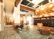 Thumbnail 21 of 22 - A room with a carpeted floor and a wooden ceiling.