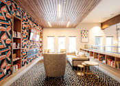 Thumbnail 15 of 22 - A room with a patterned wallpaper and a wooden ceiling.