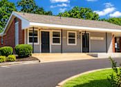 Thumbnail 1 of 4 - A small building with a sign that says "OFFICE" on the front.