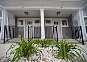 Thumbnail 4 of 17 - A house numbered 190 is shown with a front yard and a black fence.